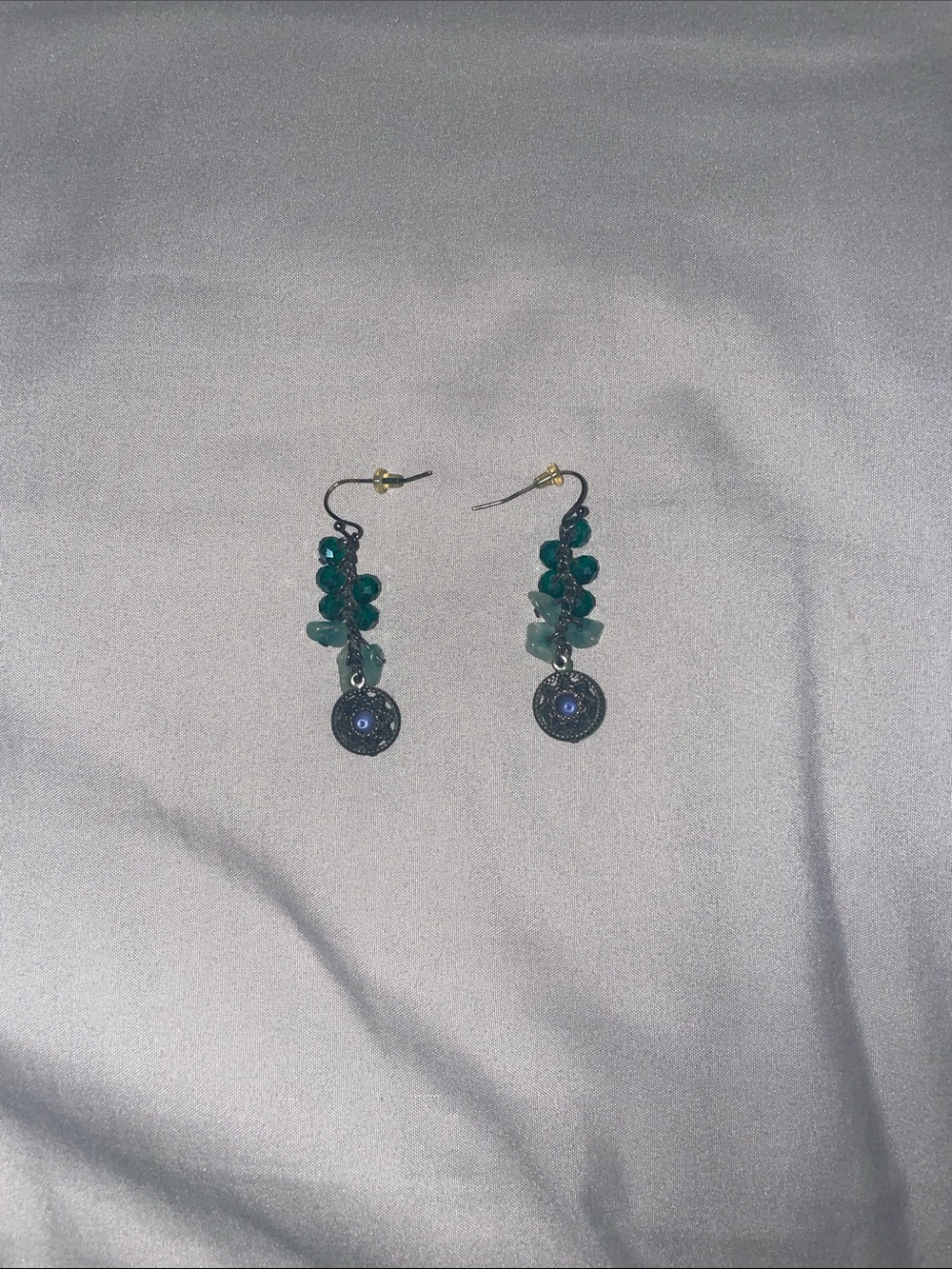celestial-themed green bead dangle earrings